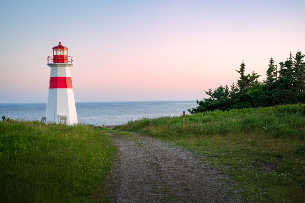 lighthouse surrounded by trees in Atlantic Canada