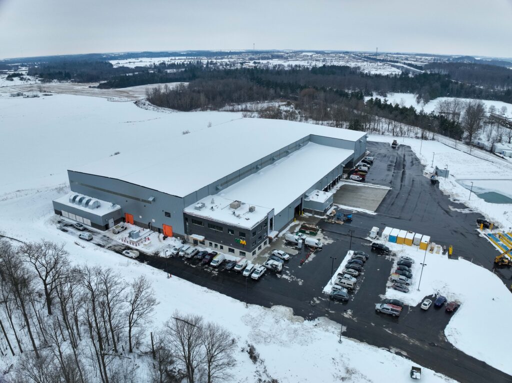 Aerial view of a state-of-the-art recycling facility in Cambridge, Ontario, surrounded by snow-covered grounds and winter conditions.